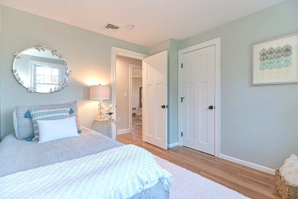 1 Duggan Road Acton, MA 01720 - Photo 17 of 25 a bedroom with a bed and a lamp
