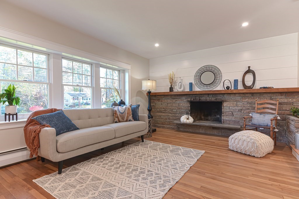 1 Duggan Road Acton, MA 01720 - Photo 3 of 25 a living room with furniture and a fireplace
