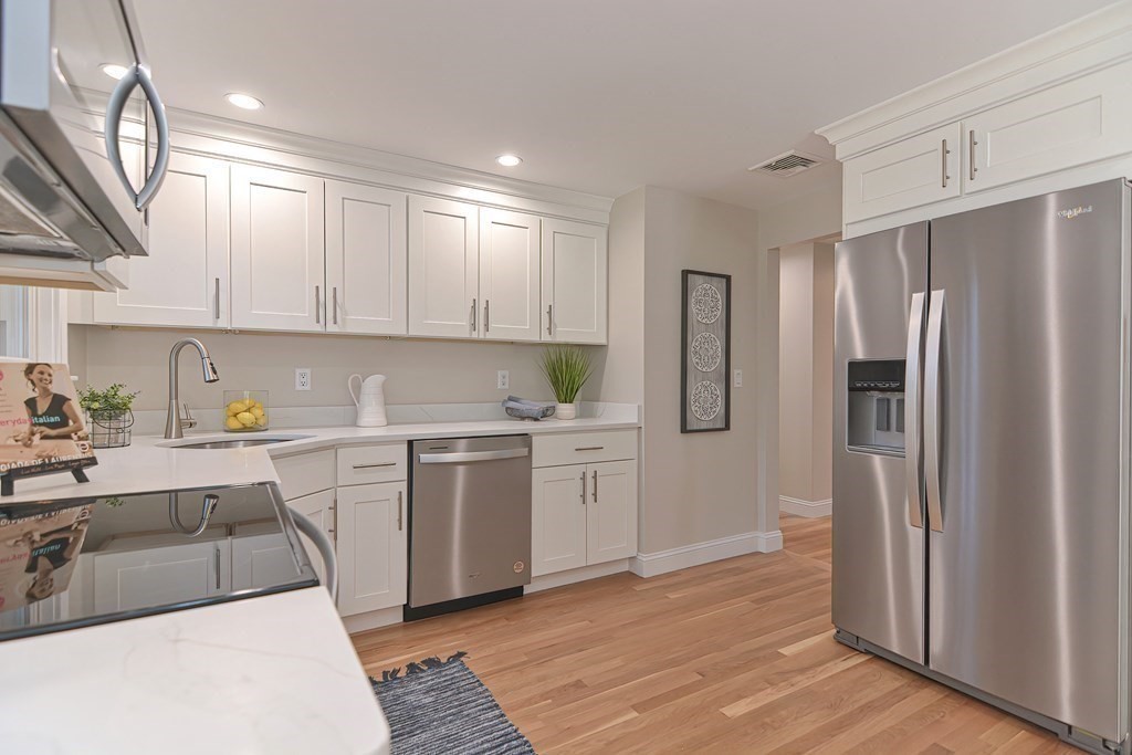 1 Duggan Road Acton, MA 01720 - Photo 7 of 25 a kitchen with a refrigerator sink and cabinets