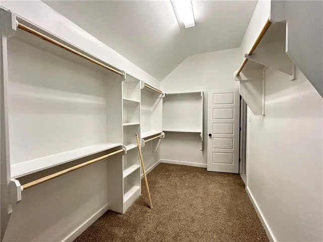 a view of closet area with empty racks