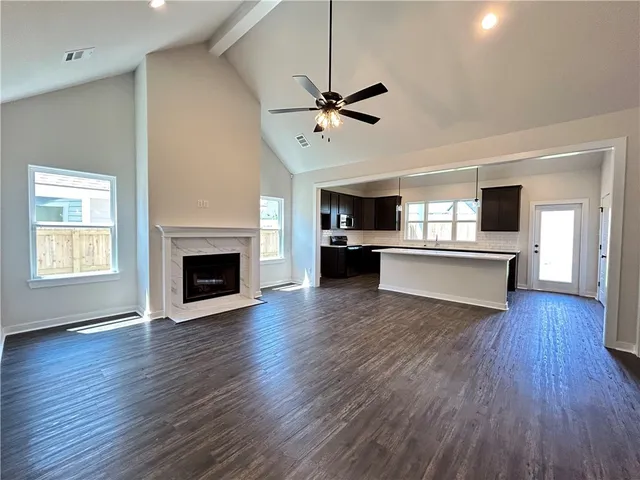 a view of a kitchen with a dishwasher stove top oven and cabinets