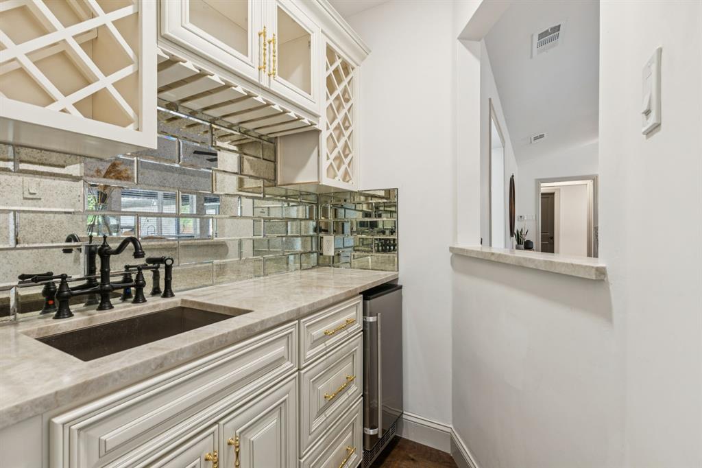 11023 Marsh Lane Dallas, TX 75229 - Photo 13 of 40 a kitchen with a sink and cabinets