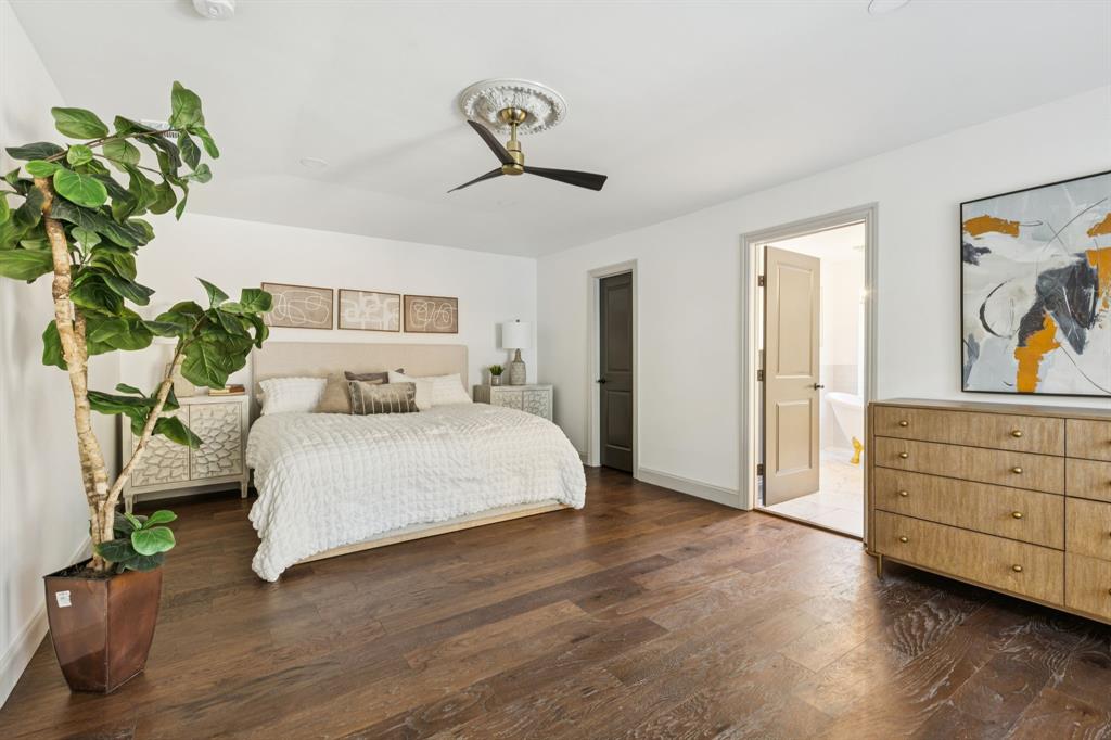 11023 Marsh Lane Dallas, TX 75229 - Photo 14 of 40 a bedroom with a bed and a painting on the wall