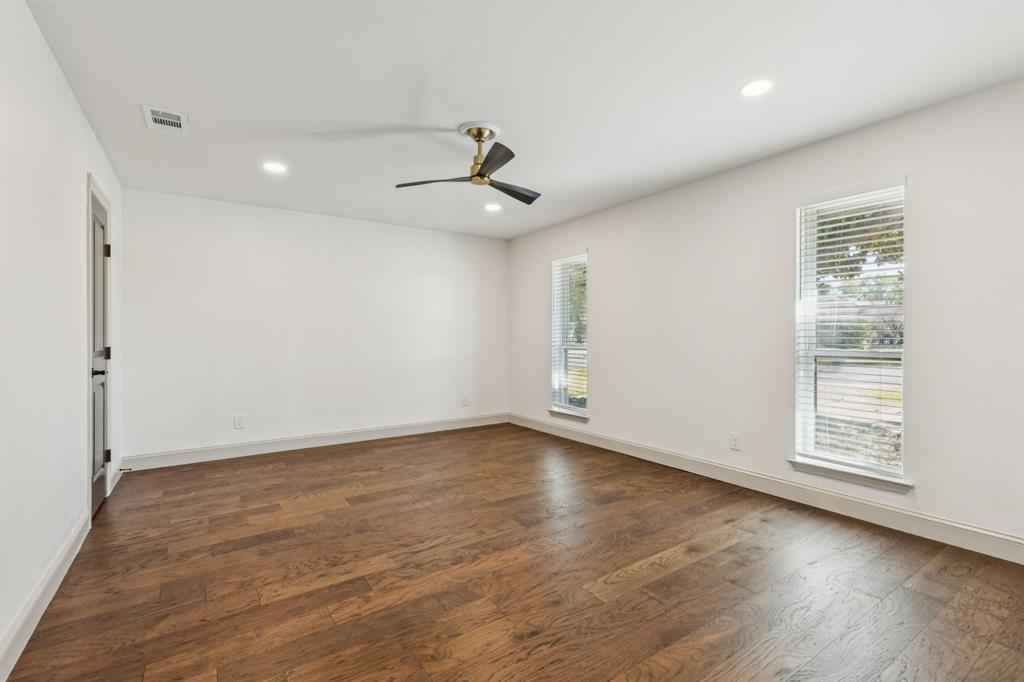 11023 Marsh Lane Dallas, TX 75229 - Photo 23 of 40 wooden floor in an empty room with a window