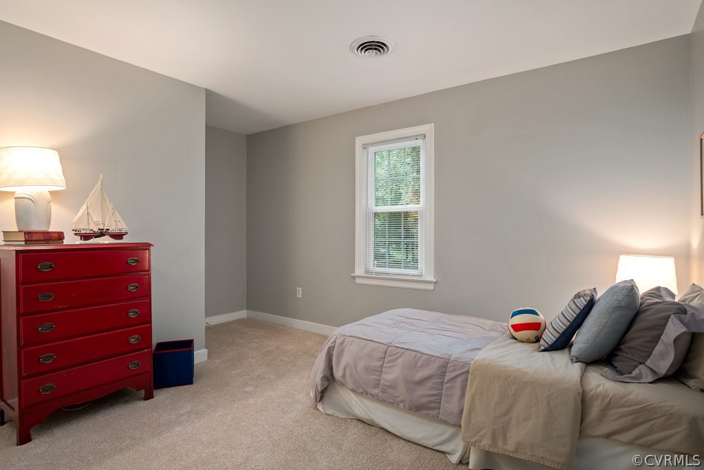 13901 Beechwood Point Road Midlothian, VA 23112 - Photo 29 of 46 a bedroom with a bed and a window