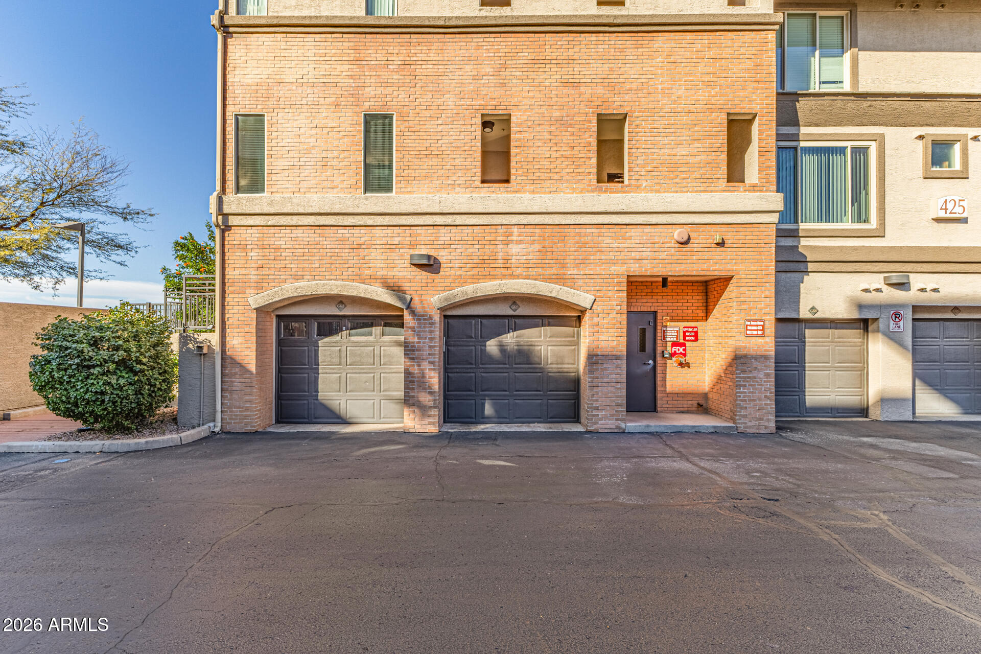 425 West Rio Salado Parkway, Unit 101 Tempe, AZ 85281 - Photo 2 of 33 a view of a grey building with a garage