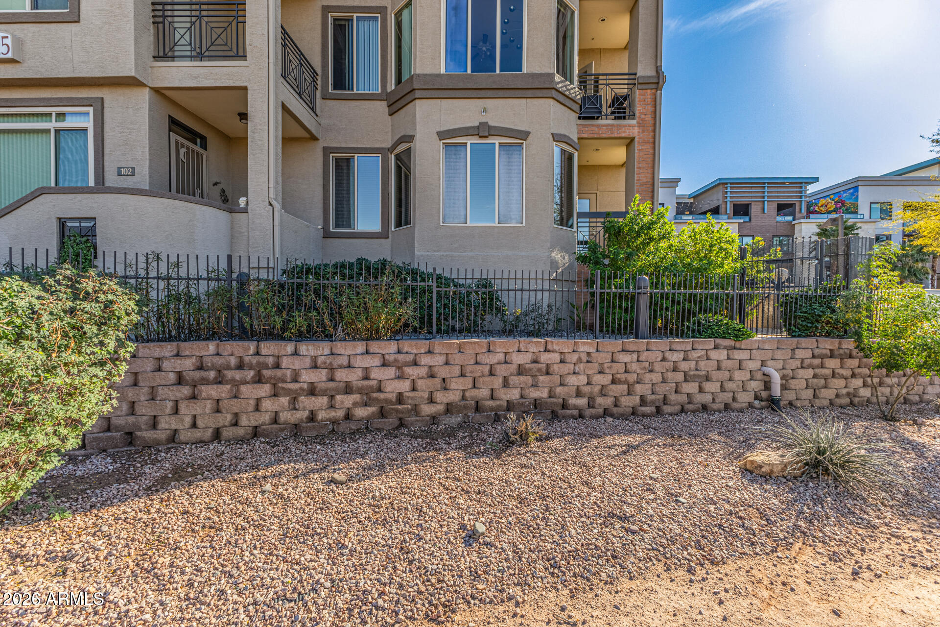 425 West Rio Salado Parkway, Unit 101 Tempe, AZ 85281 - Photo 26 of 32 a front view of a house with a garden