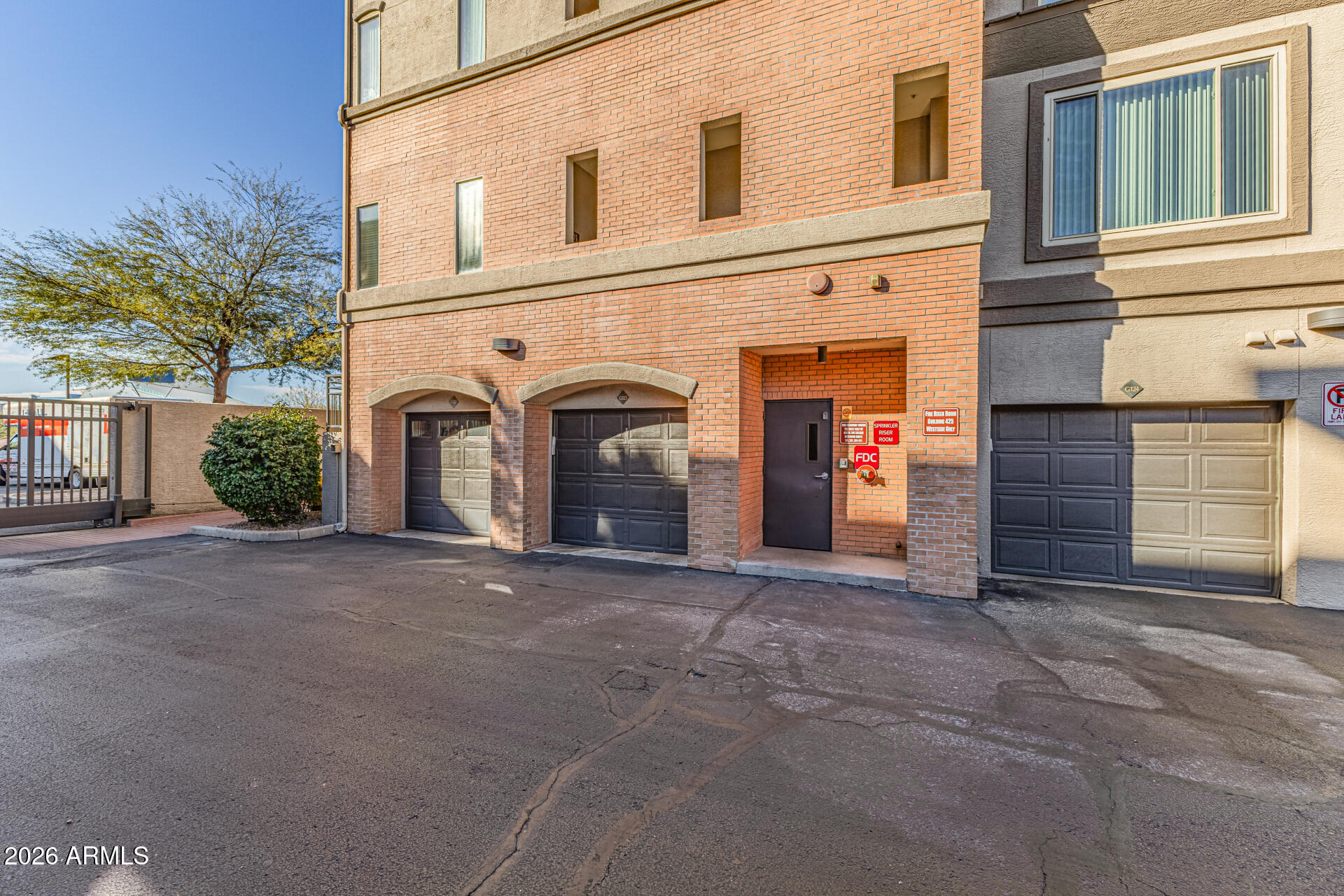 425 West Rio Salado Parkway, Unit 101 Tempe, AZ 85281 - Photo 4 of 33 a view of a house with an outdoor space and garage