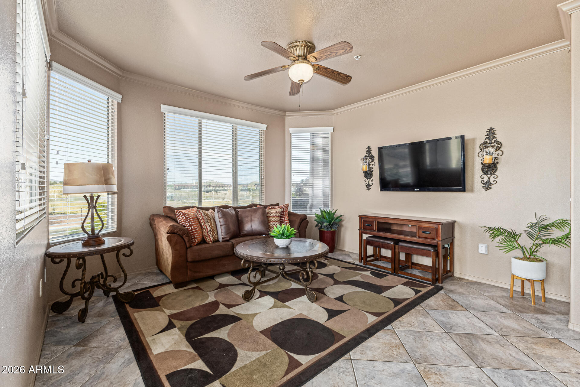 425 West Rio Salado Parkway, Unit 101 Tempe, AZ 85281 - Photo 5 of 33 a living room with furniture a flat screen tv and a large window