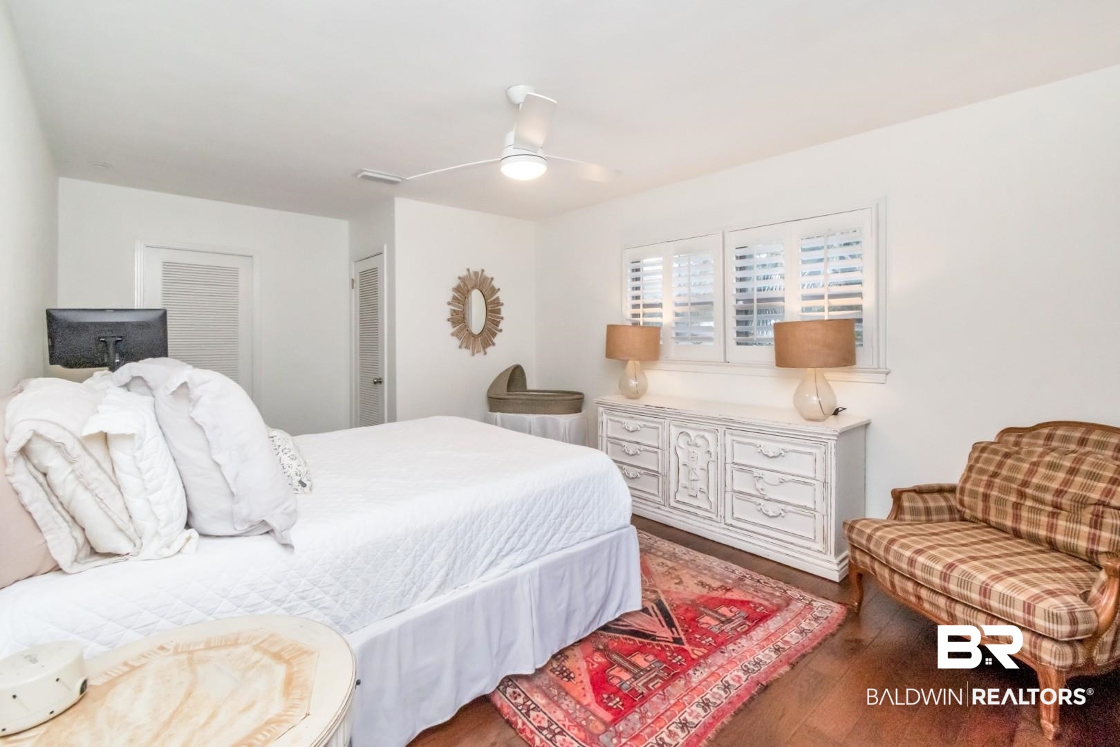 154 Fenwick Road Mobile, AL 36608 - Photo 31 of 48 Bedroom featuring a ceiling fan, dark wood finished floors, and multiple closets