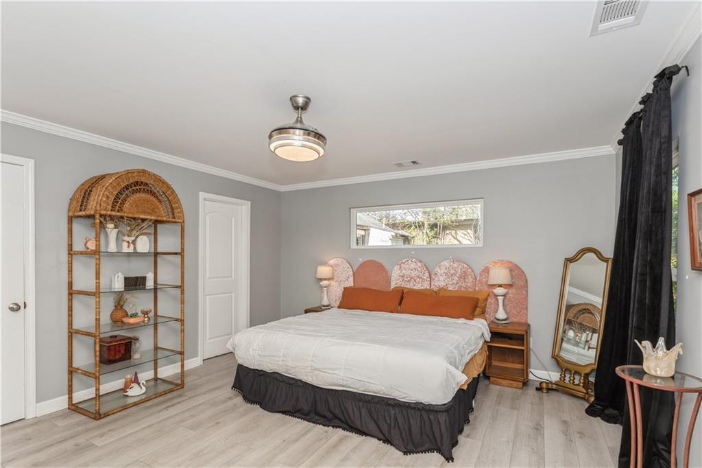 1184 Metropolitan Parkway Southwest Atlanta, GA 30310 - Photo 11 of 26 a bedroom with a large bed and a window