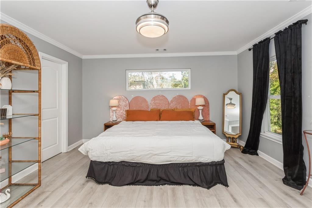 1184 Metropolitan Parkway Southwest Atlanta, GA 30310 - Photo 12 of 26 a bedroom with a bed mirror and window