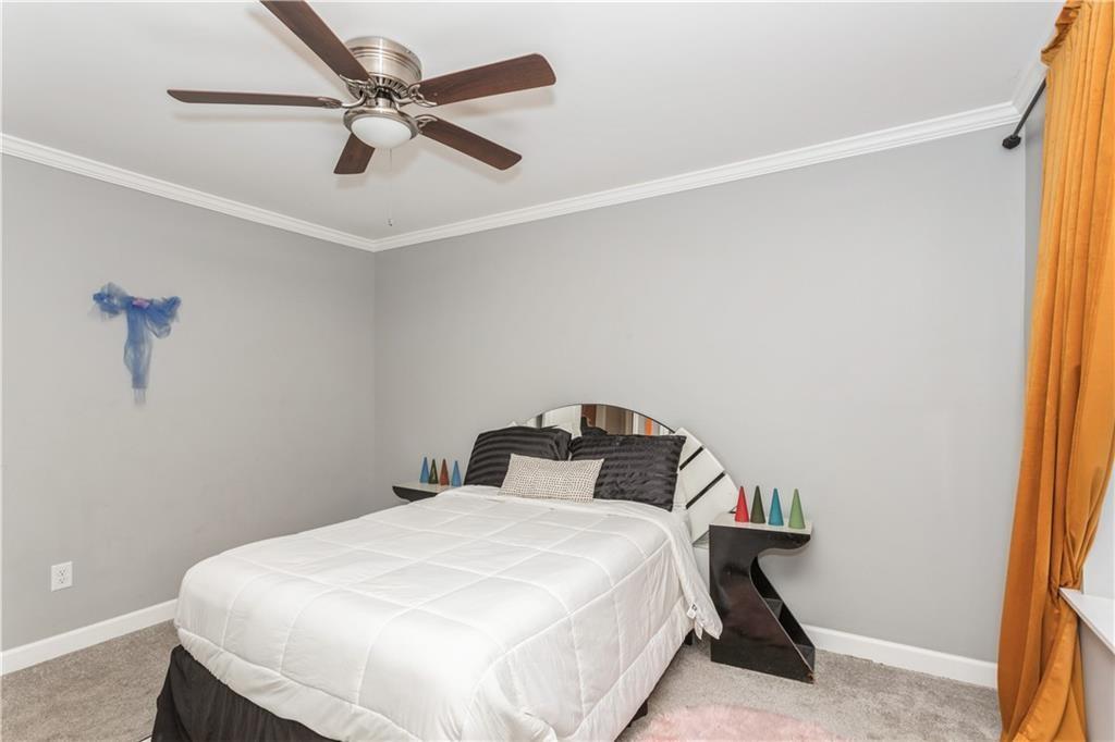 1184 Metropolitan Parkway Southwest Atlanta, GA 30310 - Photo 19 of 26 a bedroom with a bed and a window