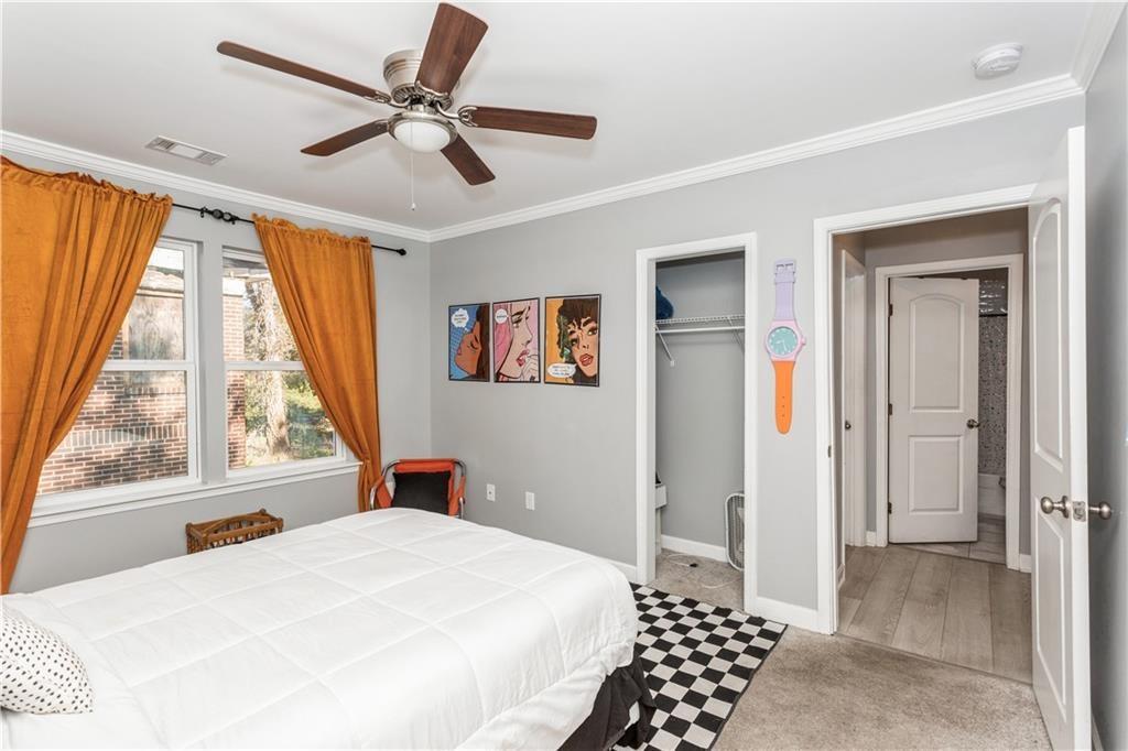 1184 Metropolitan Parkway Southwest Atlanta, GA 30310 - Photo 21 of 26 a bedroom with a bed and a large window