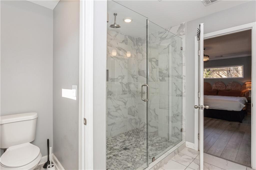 1184 Metropolitan Parkway Southwest Atlanta, GA 30310 - Photo 22 of 26 a bathroom with a shower and a toilet