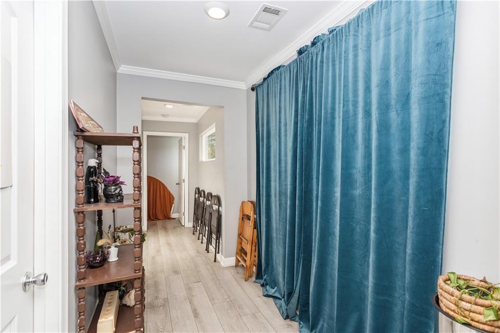 1184 Metropolitan Parkway Southwest Atlanta, GA 30310 - Photo 25 of 26 a hallway with wooden floor and closet