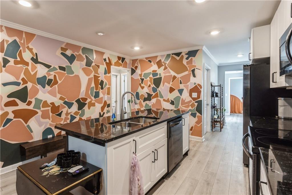 1184 Metropolitan Parkway Southwest Atlanta, GA 30310 - Photo 4 of 26 a kitchen with stainless steel appliances granite countertop a stove and a sink