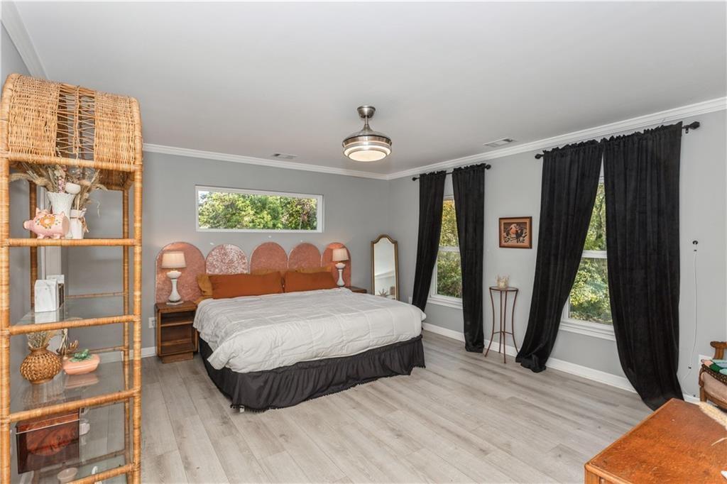 1184 Metropolitan Parkway Southwest Atlanta, GA 30310 - Photo 10 of 26 a bedroom with a large bed and a window