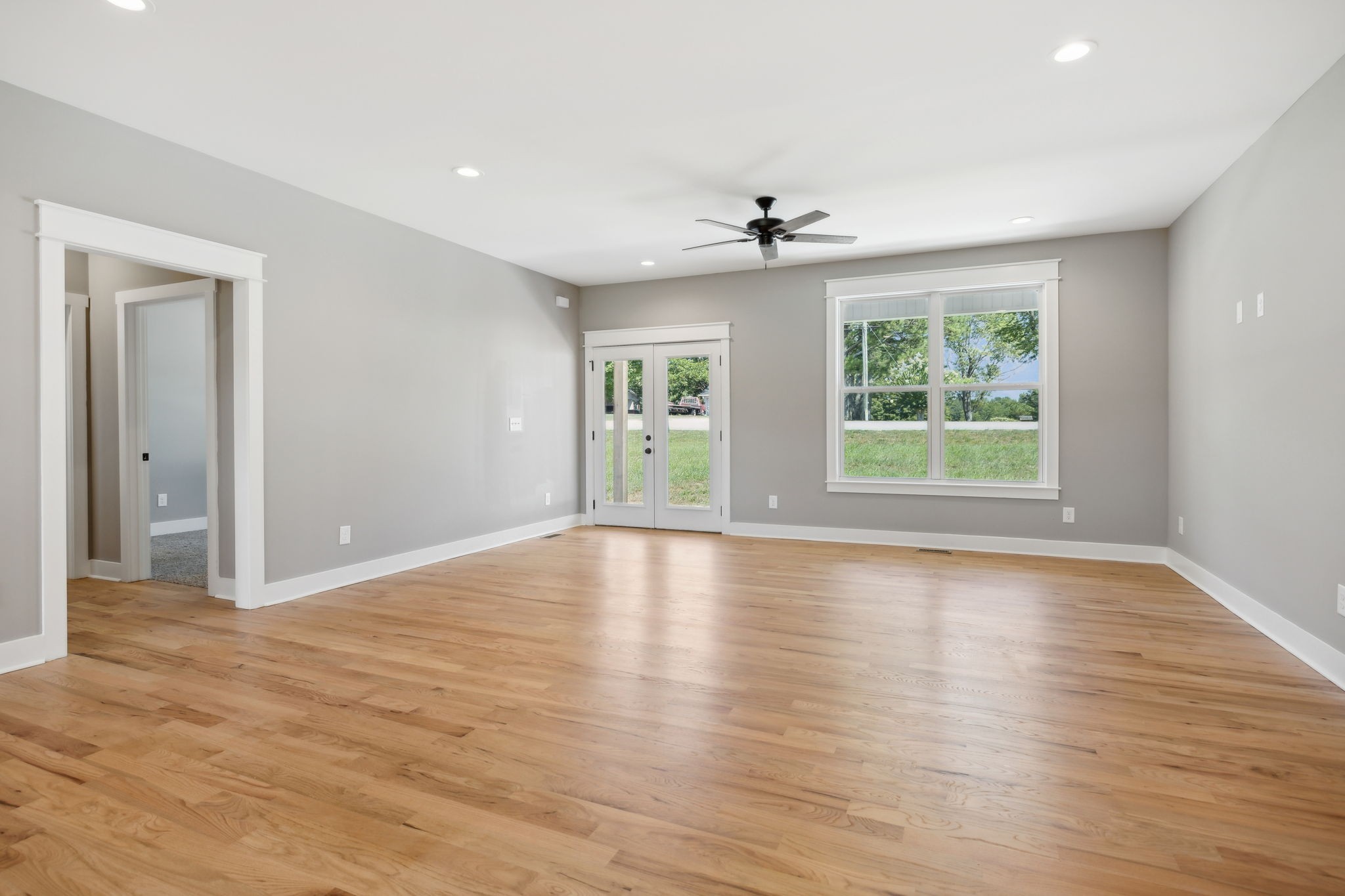 47 Long Branch Road Lawrenceburg, TN 38464 - Photo 12 of 49 a view of an empty room with wooden floor and a window
