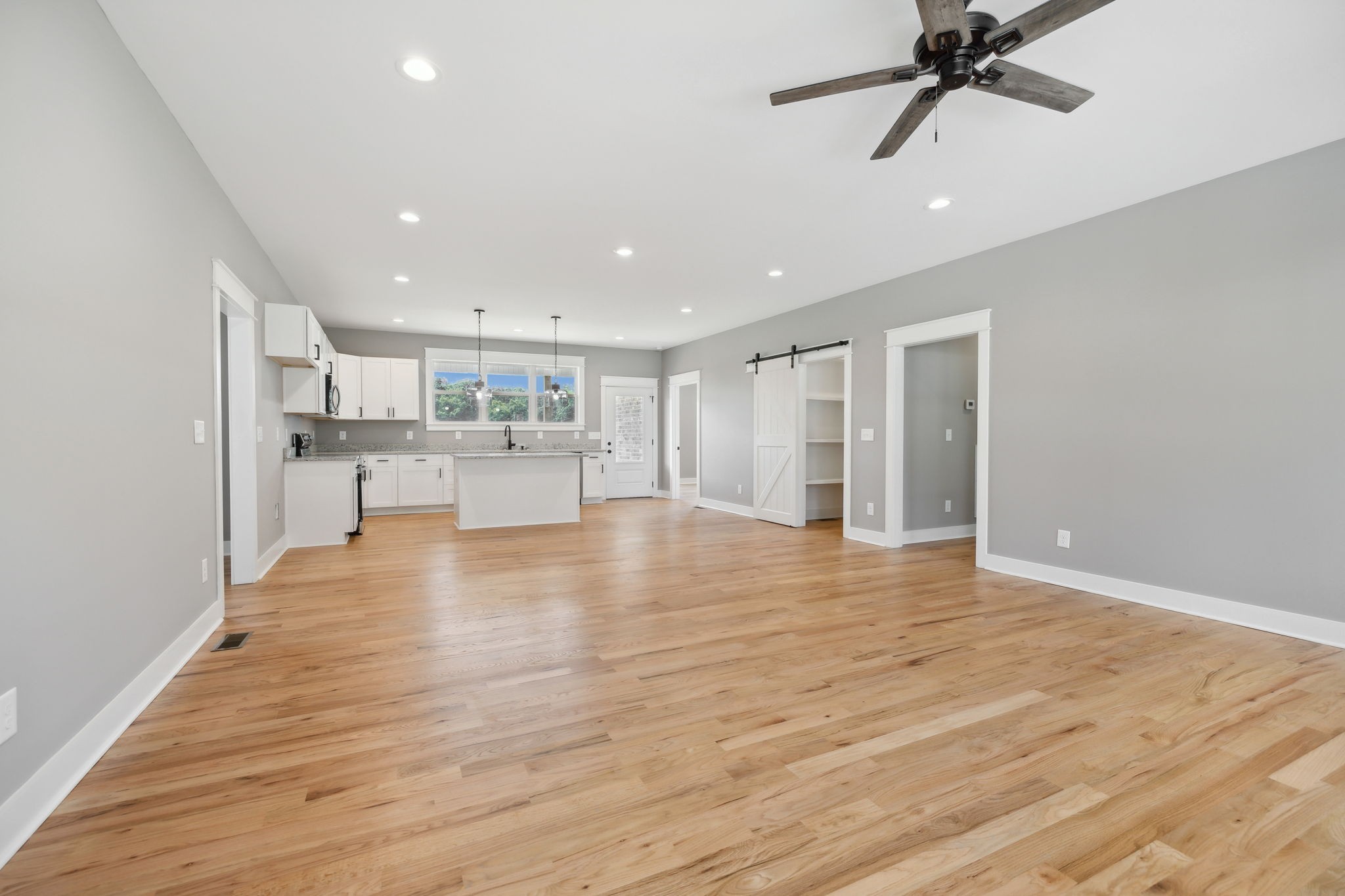 47 Long Branch Road Lawrenceburg, TN 38464 - Photo 14 of 49 a view of an empty room and kitchen view with wooden floor