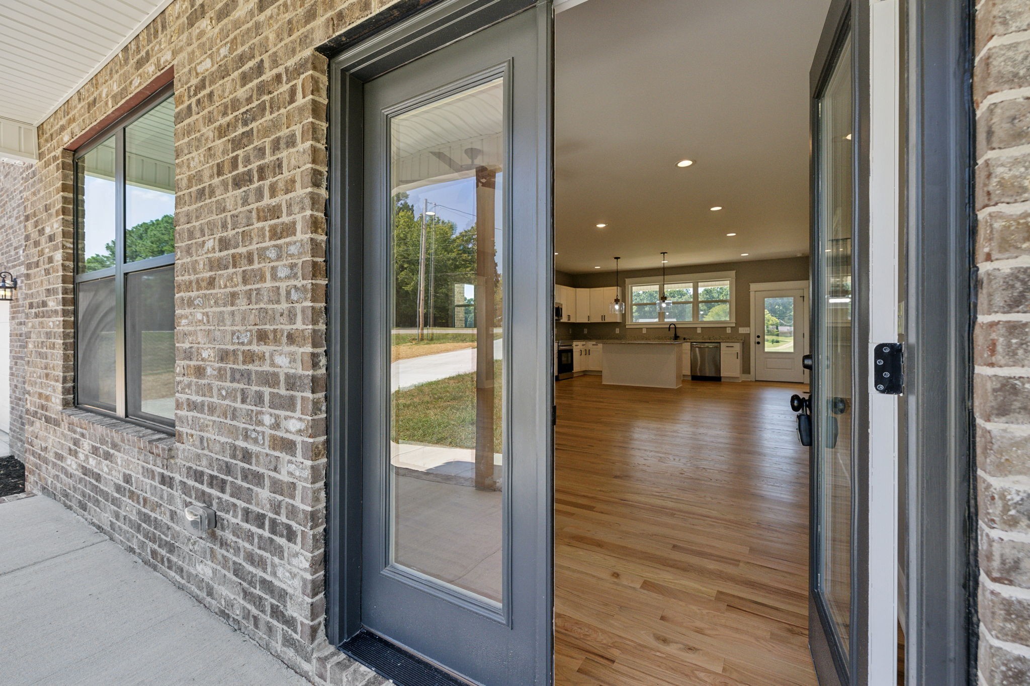 47 Long Branch Road Lawrenceburg, TN 38464 - Photo 36 of 49 a view of a hallway with wooden floor and a living room