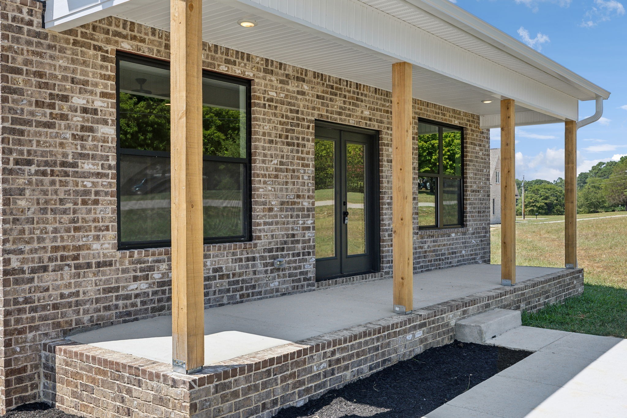 47 Long Branch Road Lawrenceburg, TN 38464 - Photo 8 of 49 a front view of a house with a porch