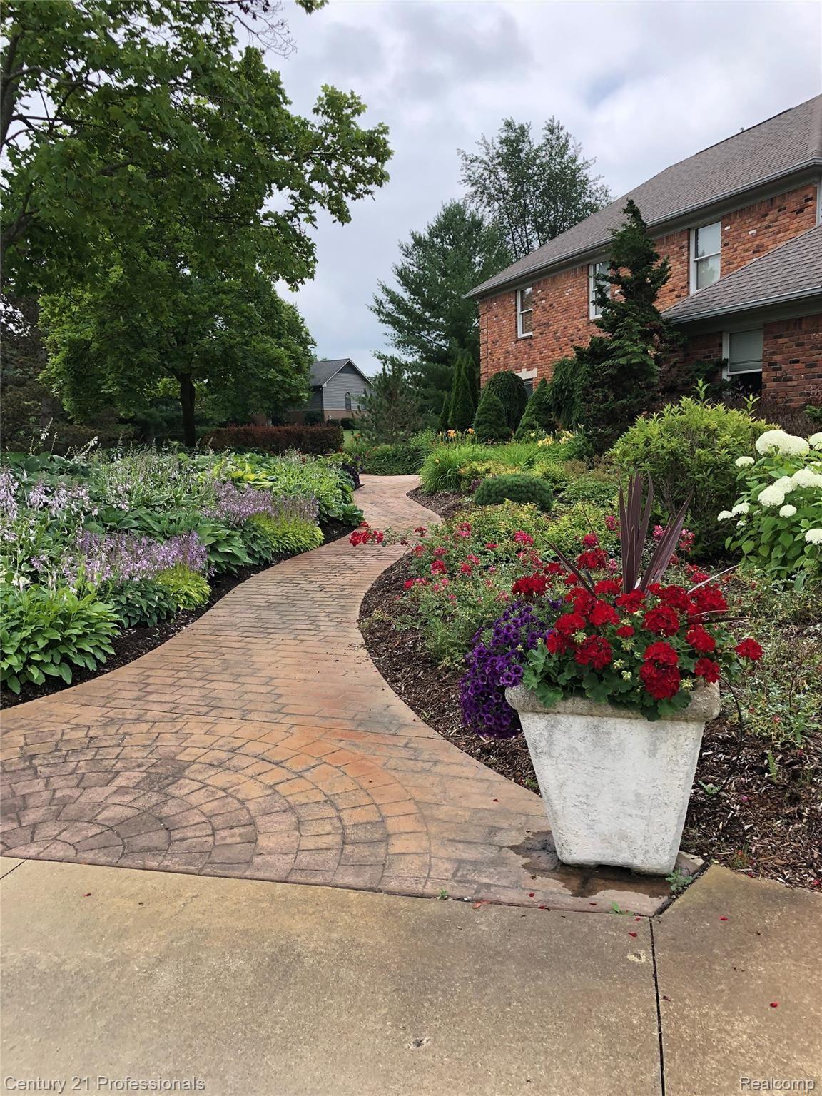 Paver brick pathway w/ gardens 
