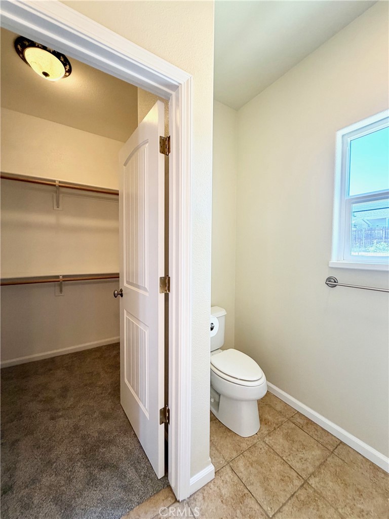 1037 Mark Twain Road Angels Camp, CA 95222 - Photo 31 of 52 a bathroom with a toilet and a shower
