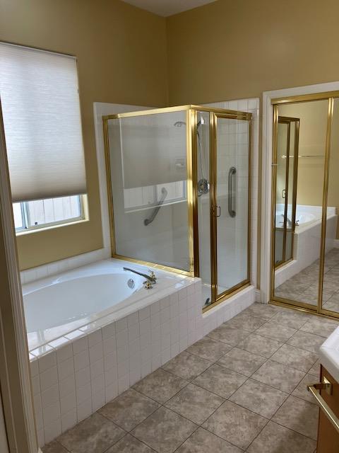 2157 West Rue St Michel Fresno, CA 93711 - Photo 11 of 22 a spacious bathroom with a tub shower and a sink