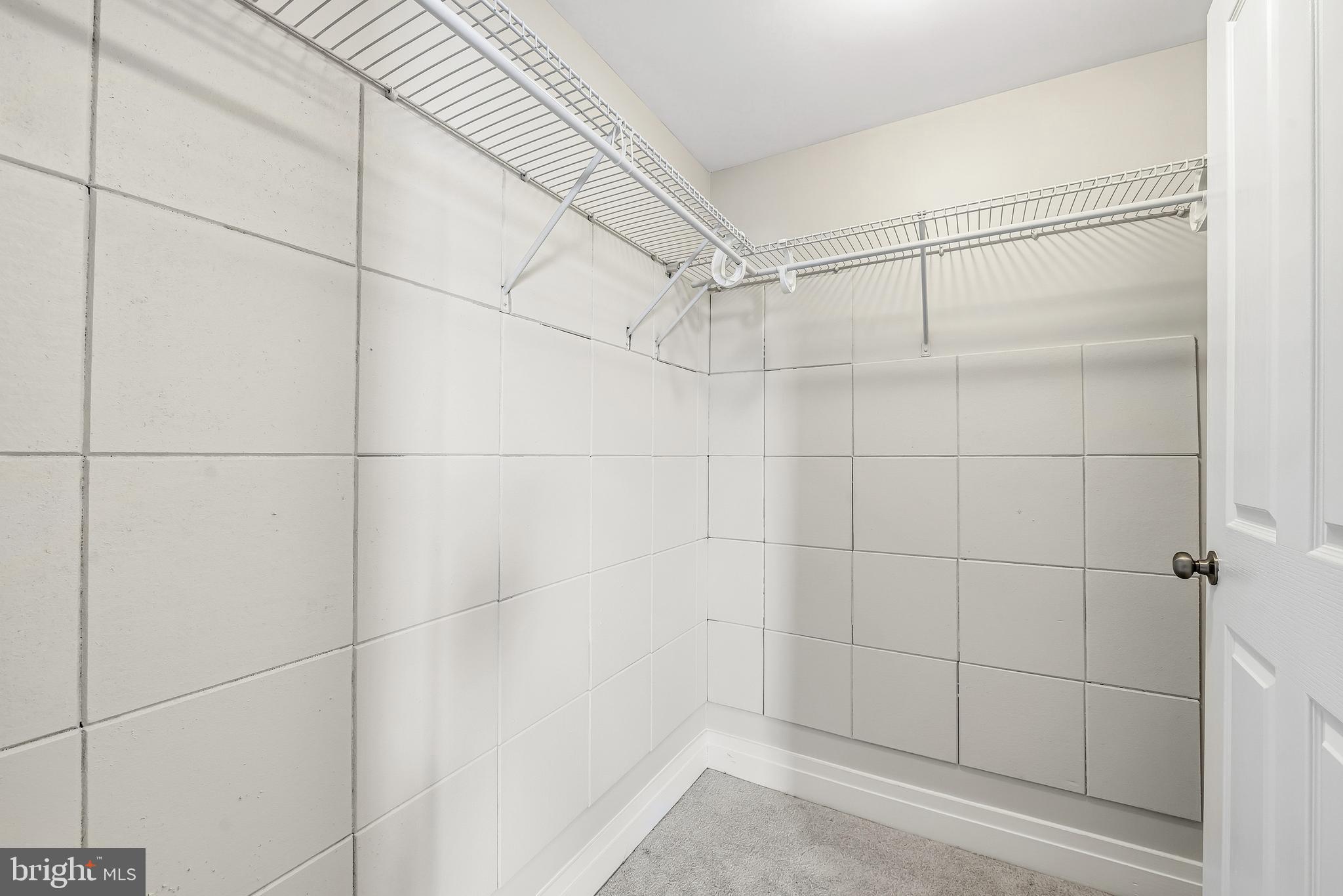 414 Water Street, Unit 1501 Baltimore, MD 21202 - Photo 20 of 35 a bathroom with a shower