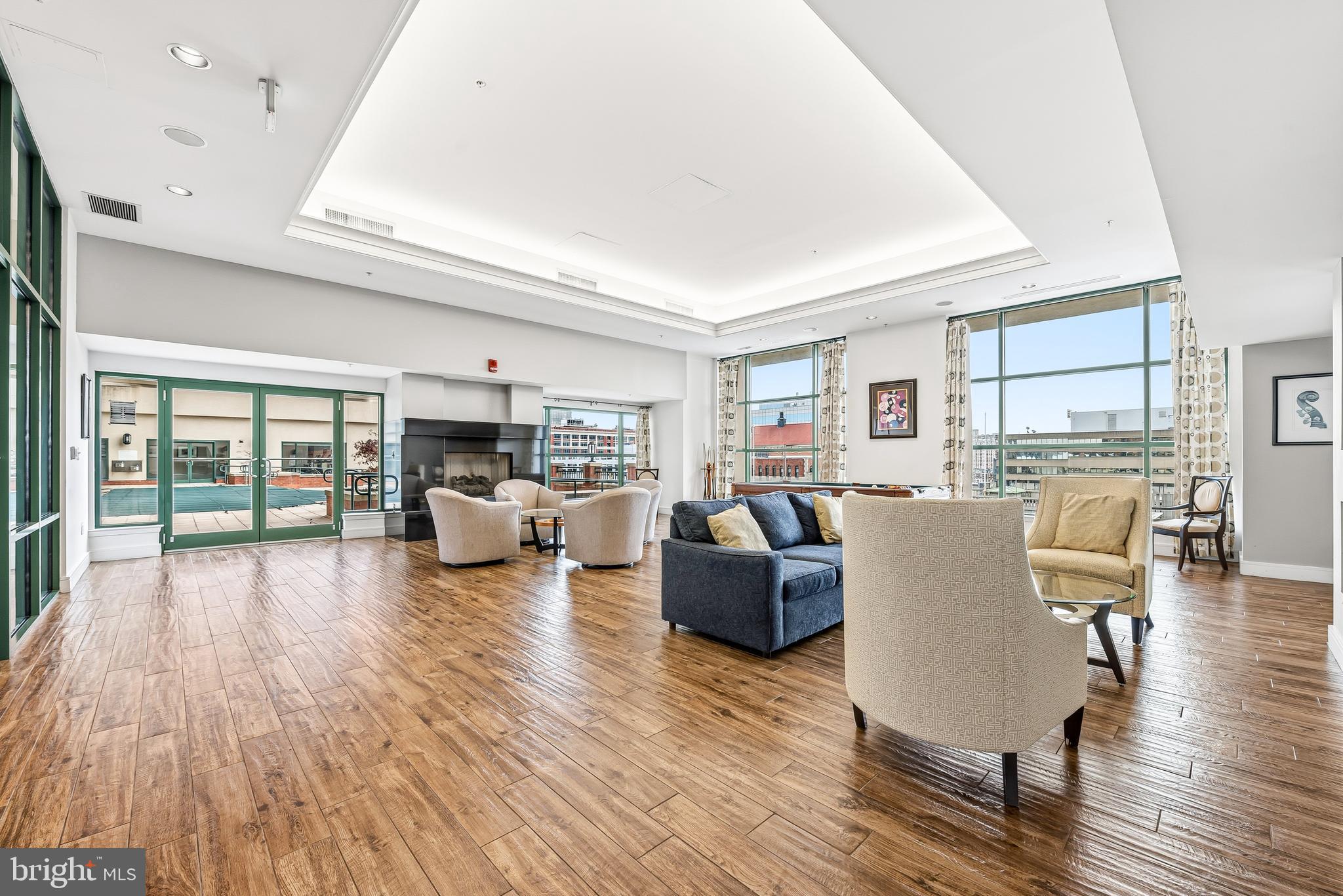414 Water Street, Unit 1501 Baltimore, MD 21202 - Photo 31 of 35 a living room with furniture and a large window