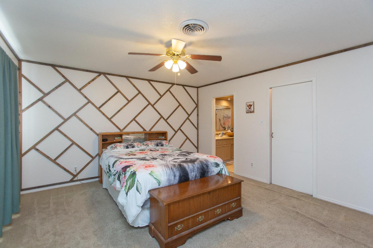 401 Fortuna Avenue Modesto, CA 95354 - Photo 20 of 43 a bedroom with bed and a chandelier