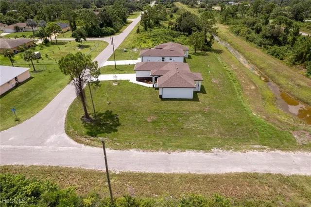 a aerial view of a house with a yard