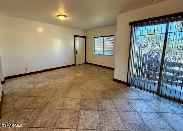 a view of an empty room with a window