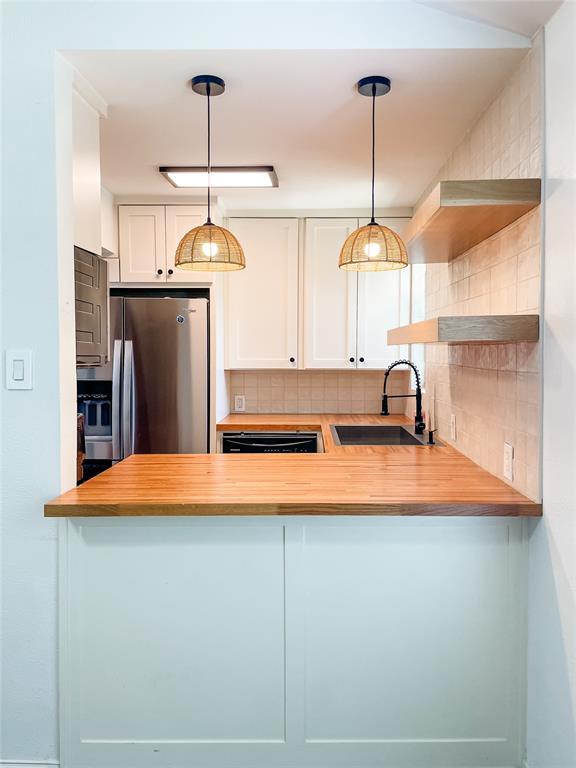 4224 Rawlins Street Dallas, TX 75219 - Photo 1 of 28 a kitchen with stainless steel appliances granite countertop a refrigerator a sink and a dishwasher
