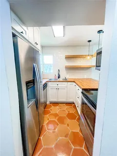 a bedroom with a bed and a ceiling fan