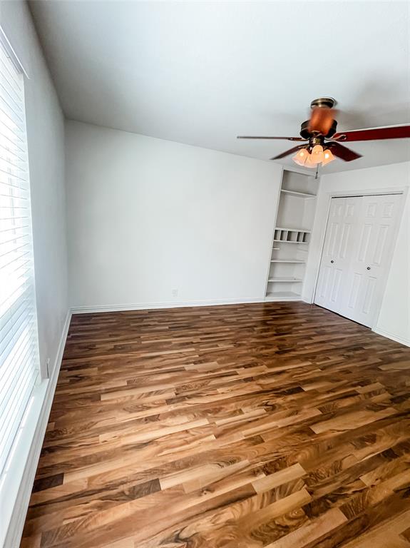 4224 Rawlins Street Dallas, TX 75219 - Photo 14 of 28 a view of a room with wooden floor and shoes