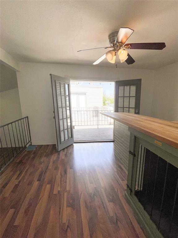 4224 Rawlins Street Dallas, TX 75219 - Photo 20 of 28 a view of an empty room with wooden floor and a window