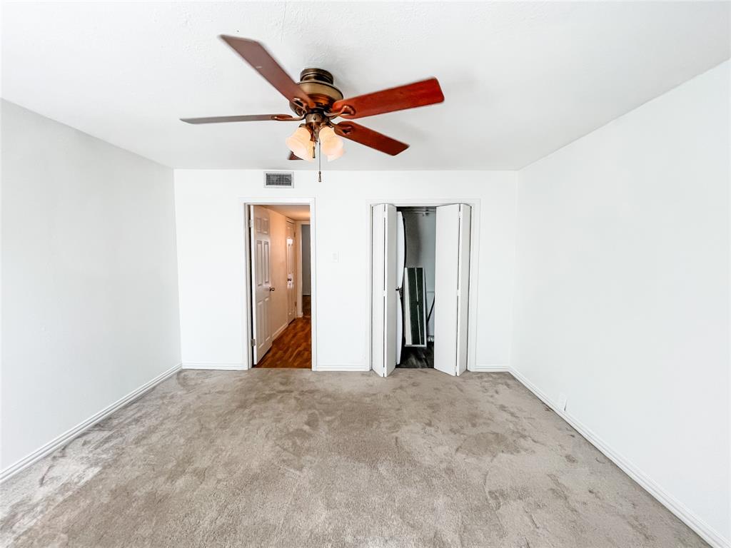 4224 Rawlins Street Dallas, TX 75219 - Photo 26 of 28 a view of a room with a ceiling fan