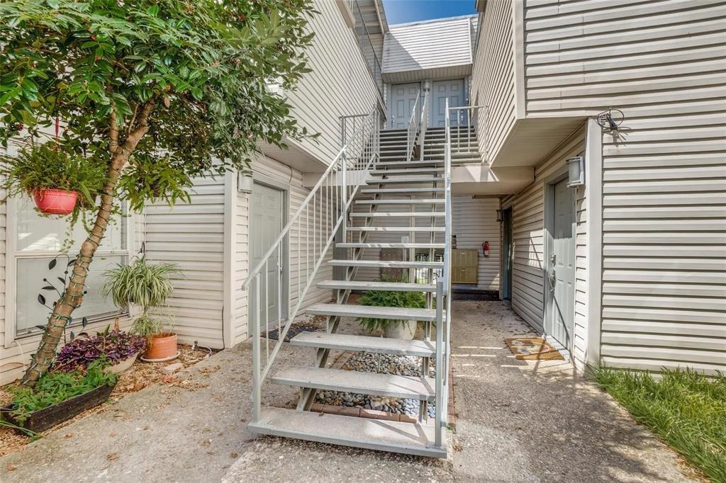 4224 Rawlins Street Dallas, TX 75219 - Photo 3 of 28 a view of wooden door with a tree