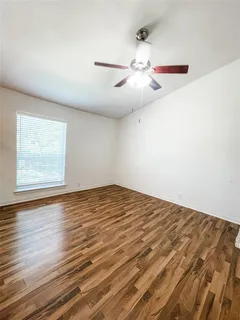 a view of a kitchen with wooden floor
