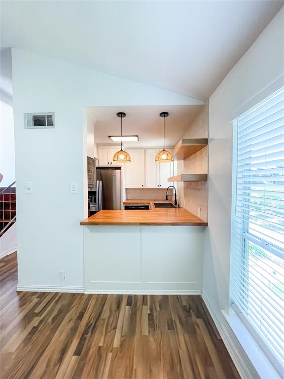 4224 Rawlins Street Dallas, TX 75219 - Photo 10 of 28 a view of a kitchen with wooden floor
