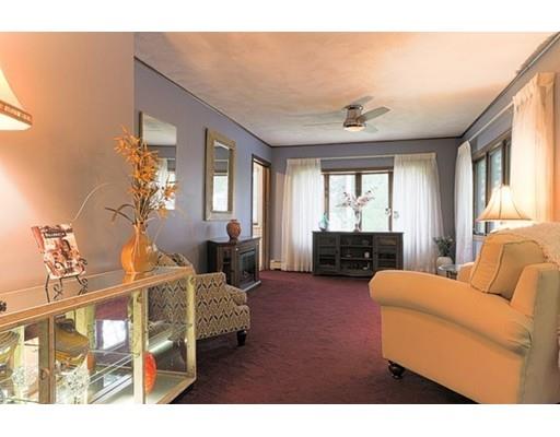 32 Woodland Road Billerica, MA 01821 - Photo 1 of 19 a living room with furniture a chandelier and a flat screen tv