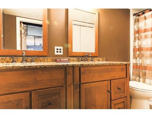 32 Woodland Road Billerica, MA 01821 - Photo 12 of 19 a bathroom with a sink and a mirror