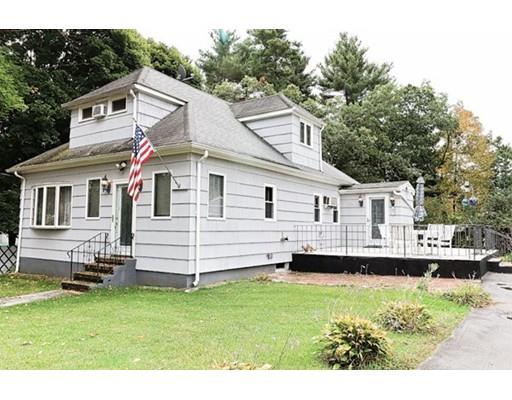32 Woodland Road Billerica, MA 01821 - Photo 14 of 19 a view of a white house with a big yard and large trees