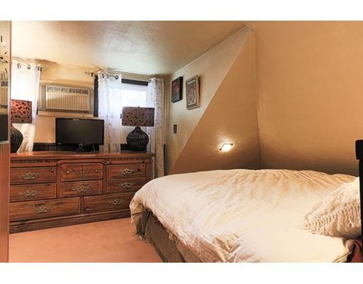 32 Woodland Road Billerica, MA 01821 - Photo 9 of 19 a bedroom with a bed and a flat screen tv