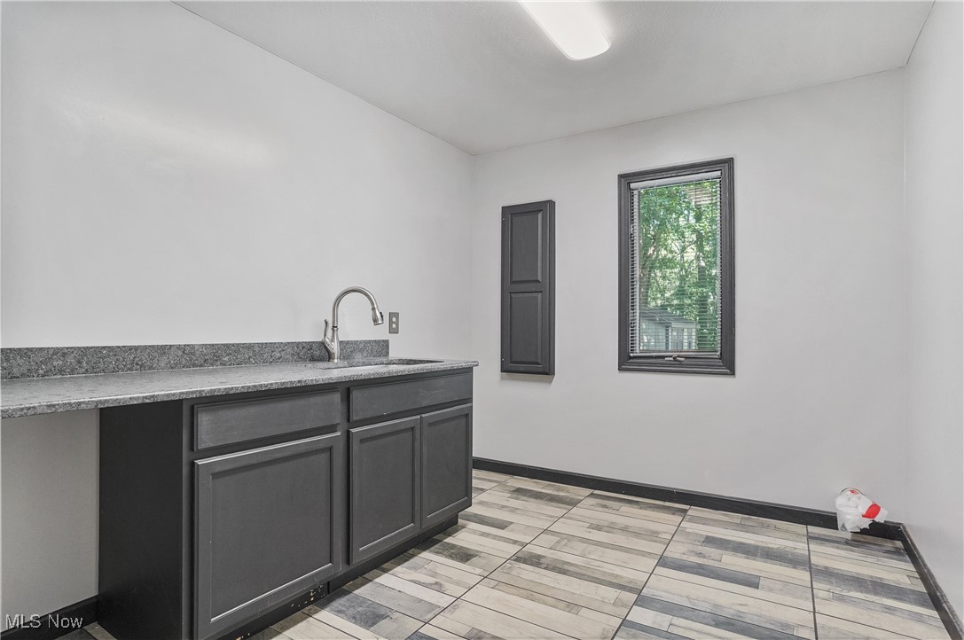 370 Wilcox Road Youngstown, OH 44515 - Photo 20 of 49 Kitchen with baseboards and a sink