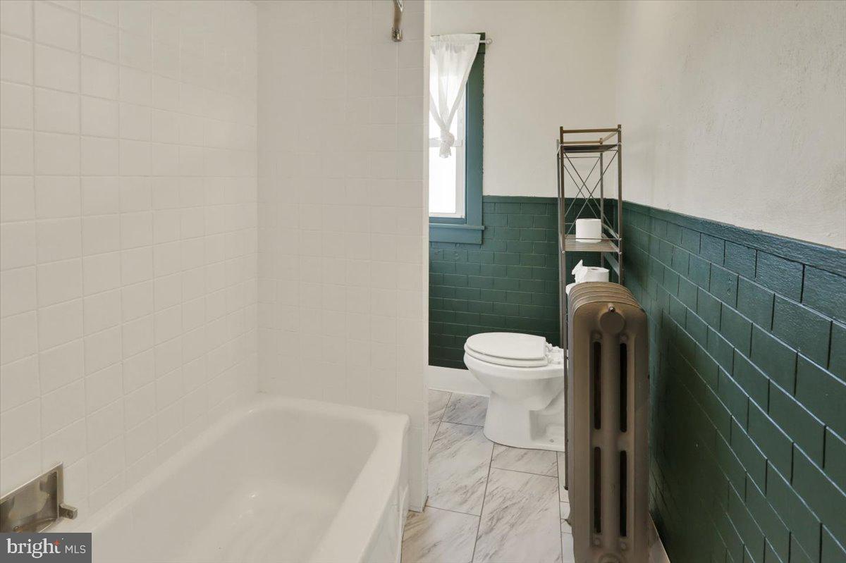 29 Arlington Street Reading, PA 19611 - Photo 16 of 32 a bathroom with a toilet and a shower