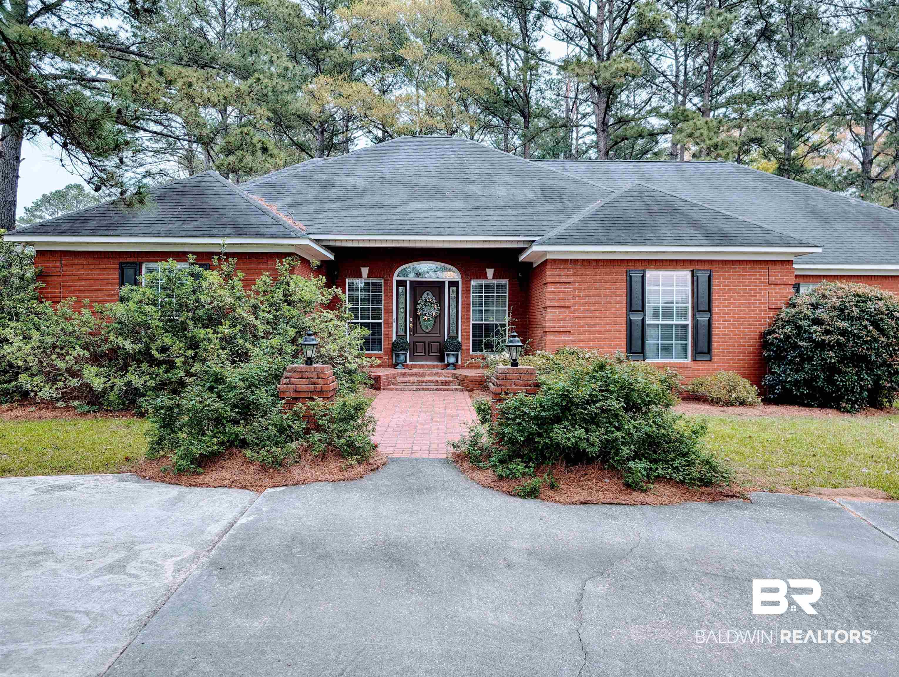 506 Old Castleberry Road Brewton, AL 36426 - Photo 1 of 14 Ranch-style home with brick siding and a shingled roof