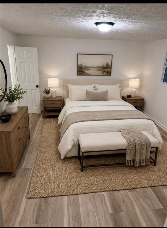 6855 Kimberly Mill Road Atlanta, GA 30349 - Photo 8 of 11 a bedroom with a bed and a couch